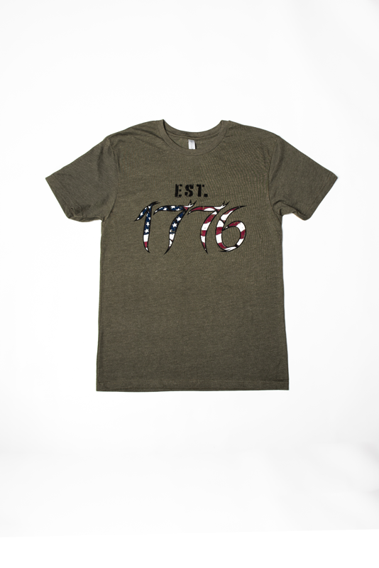 Next level brand t-shirt in Army Green. 1776 logo printed with a distressed American Flag design on front of chest. HardWater Life printed in distressed black ink on back shoulder.